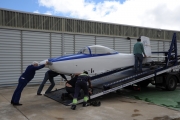 <h5>Unloading at the airport</h5><p>and unloading it from the truck at Robledillo airdrome, some 60 NM northeast of Madrid, a very beautiful place, close to the mountains. The day was rainy, and a lot of care was necessary for the driver to have the plane safely into the airfield</p>